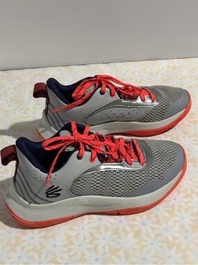 Under Armour Curry 
Navy and Coral Kids Athletic Sneakers